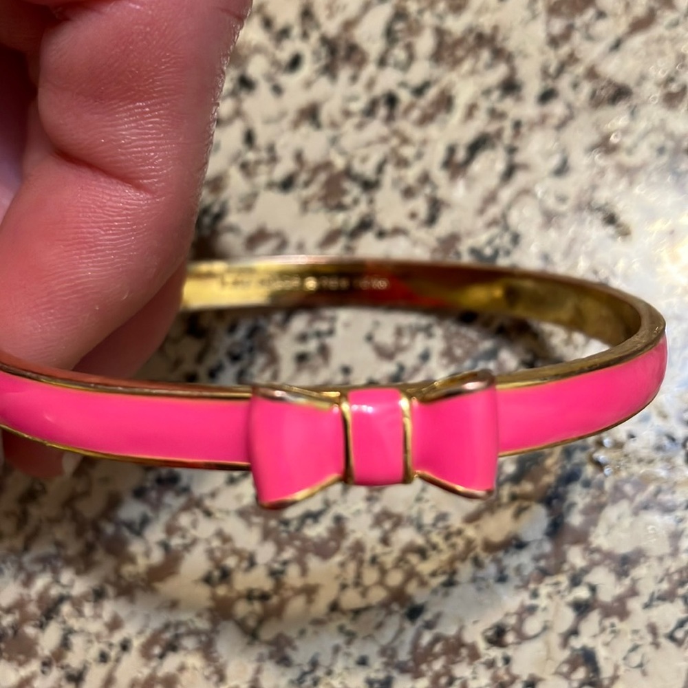 Kate Spade gold and pink bow bangle bracelet